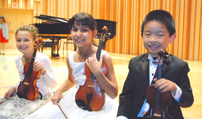 2014 Graduation at Zipper Hall, from left, Maya Rustenburg, Sophie Peltz and Benjamin Wong